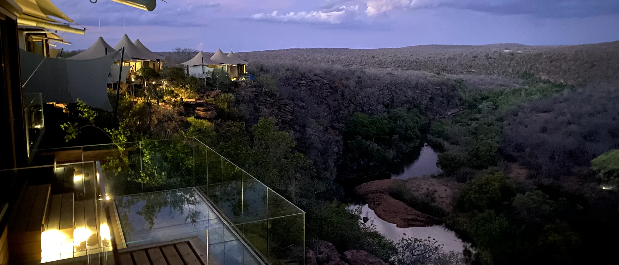 Dusk view over the Palala River valley from a Noka Camp villa with glass-edged pool