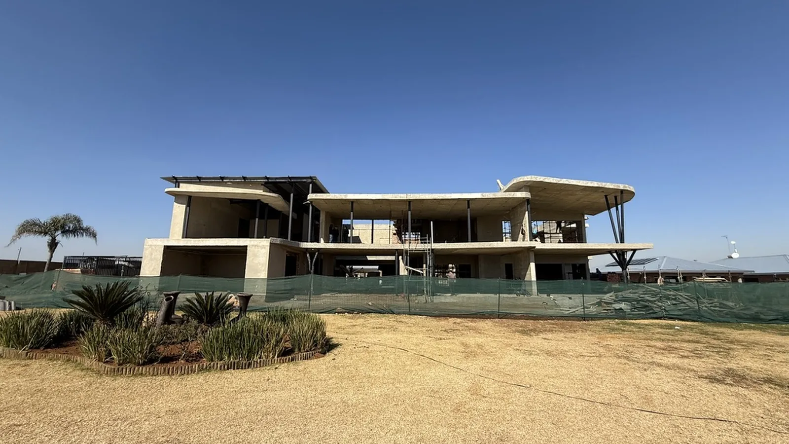 The Brakpan residence under construction — a double-storey home with dramatic cantilevered concrete roofs