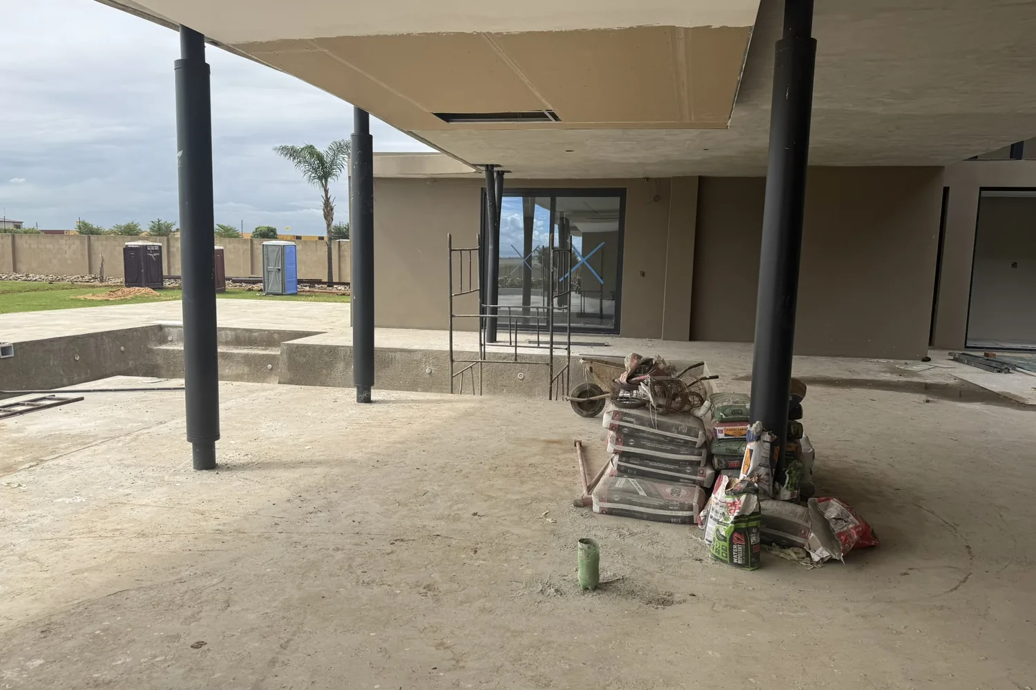 Covered terrace and pool deck at the Brakpan residence during construction