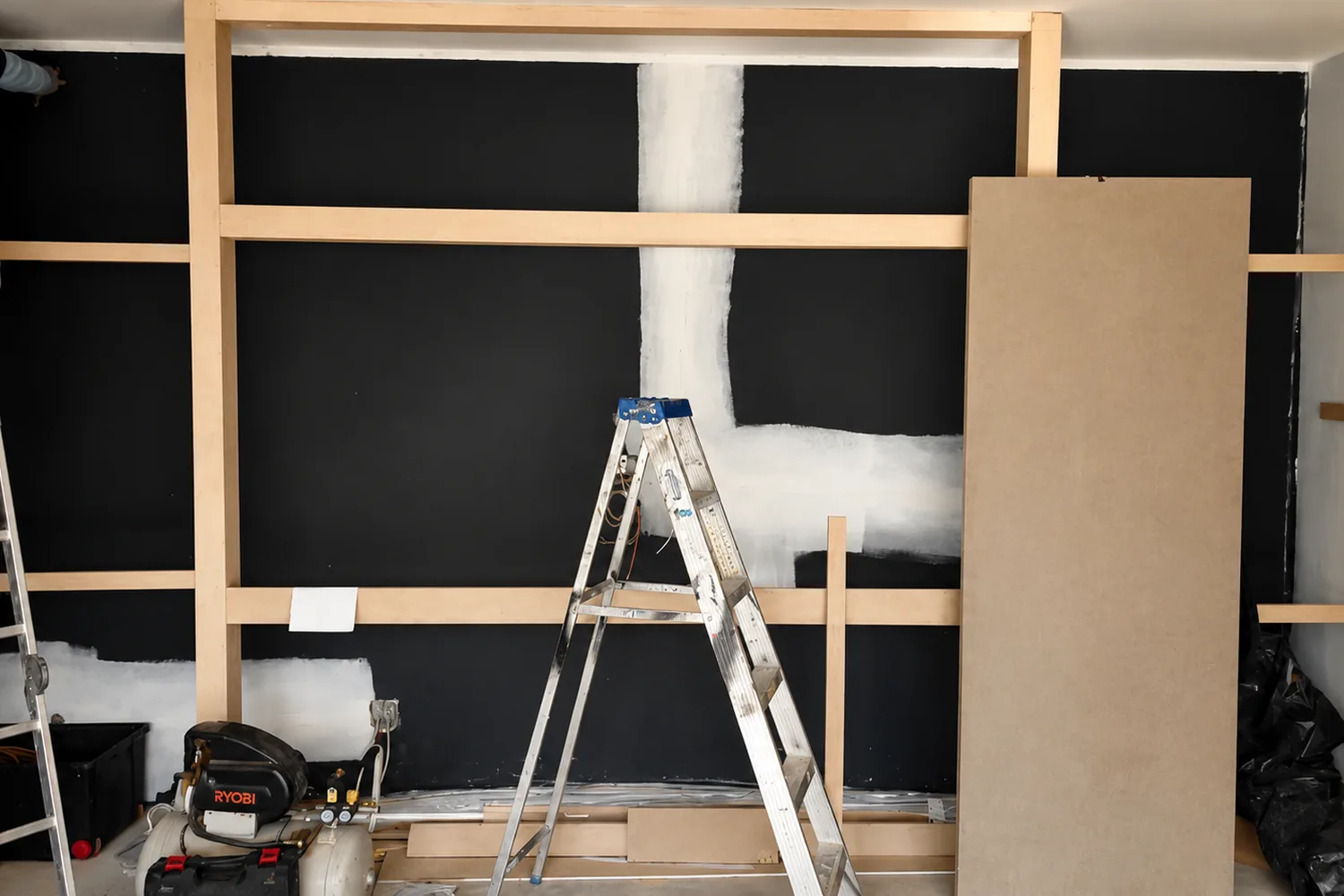 Acoustic treatment underway across the cinema walls with framing and panelling in progress